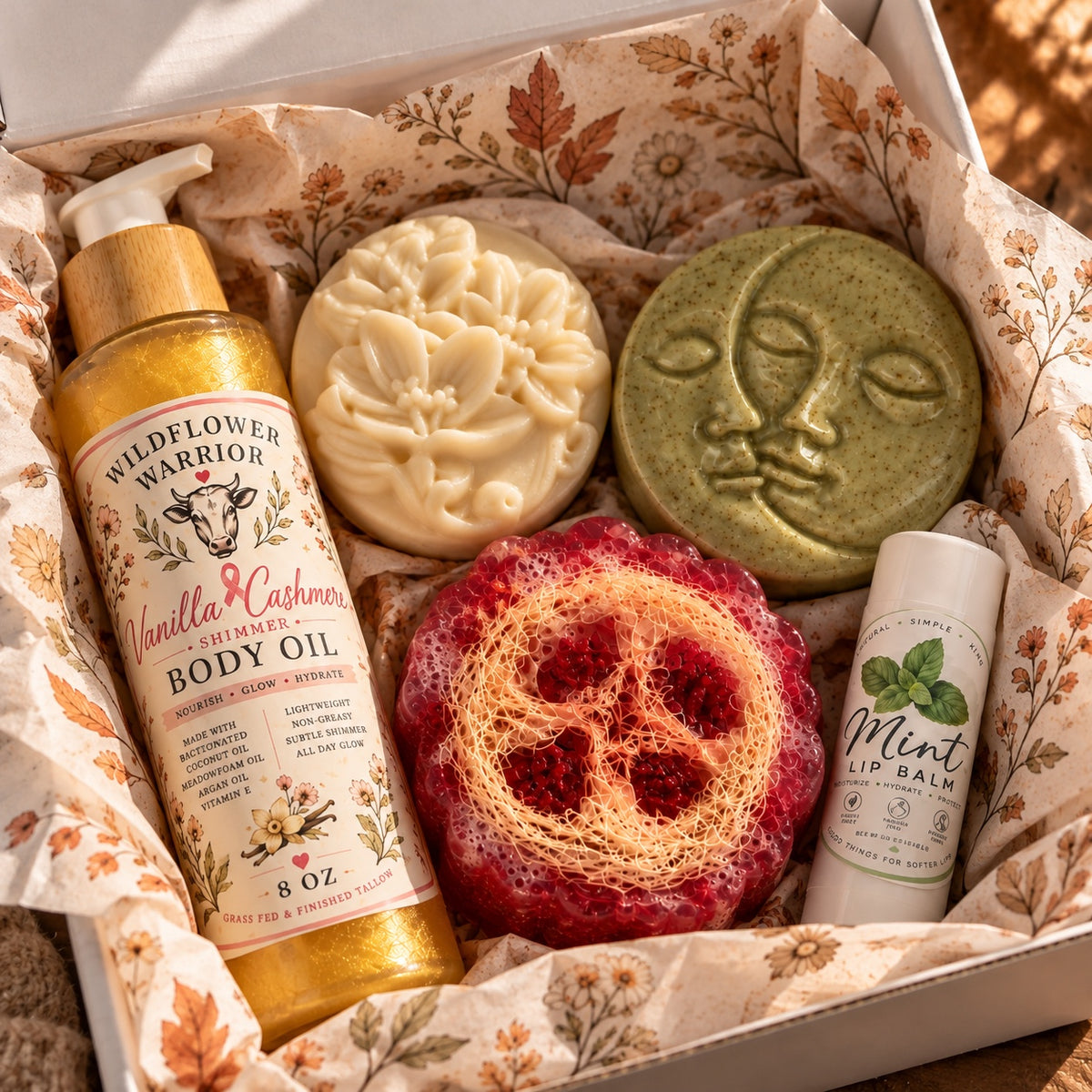 Everything Shower Bundle with body oil, shampoo and conditioner bars, loofah soap and mint lip balm in an autumn tissue-lined box