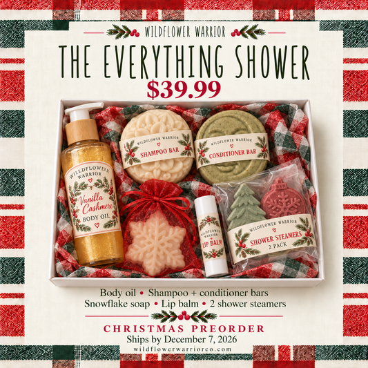 The Everything Shower Christmas gift box with body oil, shampoo and conditioner bars, bagged snowflake soap, lip balm and Christmas tree and ornament shower steamers