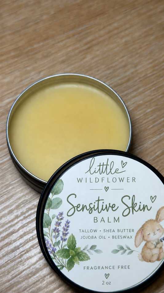 Little Wildflower Sensitive Skin Balm in a black 2 oz tin with a rabbit and botanical label.